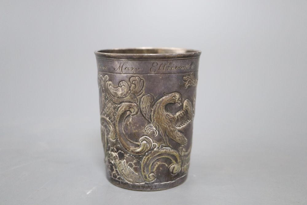 An 18th century Russian embossed white metal beaker, dated 1776, with later inscription, 75mm, 71.9 grams.